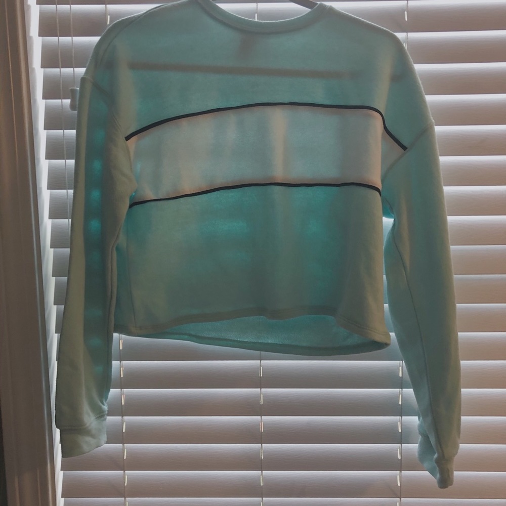 Teal long sleeve shirt.